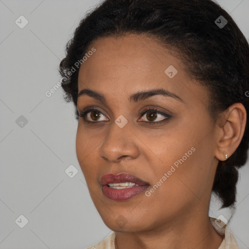 Joyful black young-adult female with short  brown hair and brown eyes