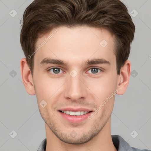 Joyful white young-adult male with short  brown hair and grey eyes