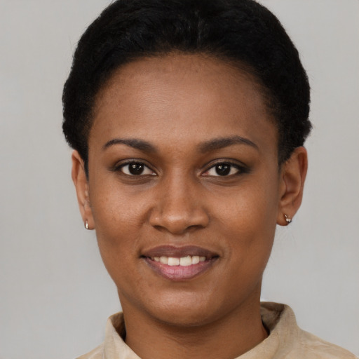 Joyful latino young-adult female with short  black hair and brown eyes