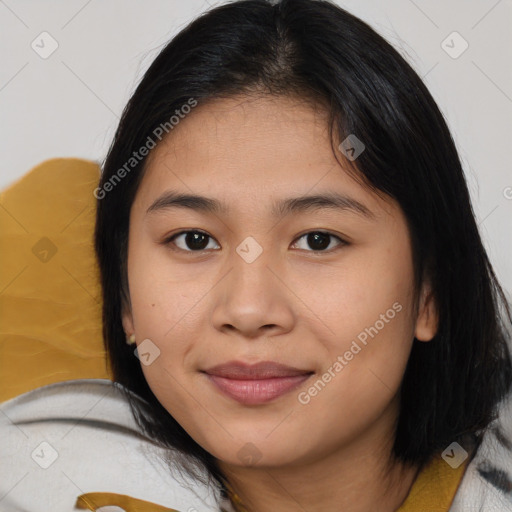 Joyful asian young-adult female with medium  black hair and brown eyes