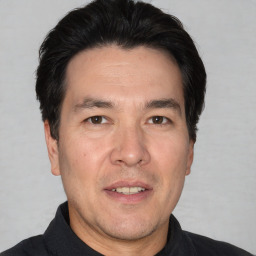 Joyful white adult male with short  black hair and brown eyes
