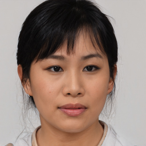 Neutral asian young-adult female with medium  brown hair and brown eyes