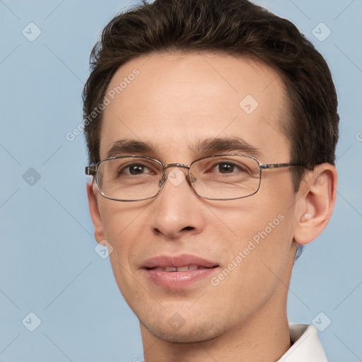 Joyful white adult male with short  brown hair and brown eyes