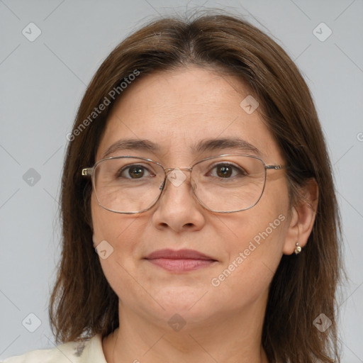 Joyful white adult female with medium  brown hair and brown eyes