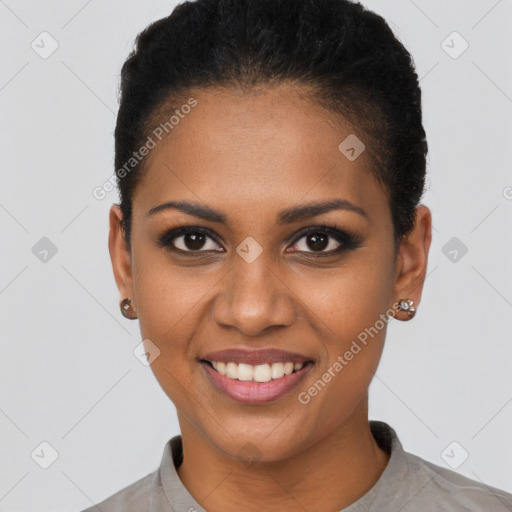 Joyful black young-adult female with short  brown hair and brown eyes