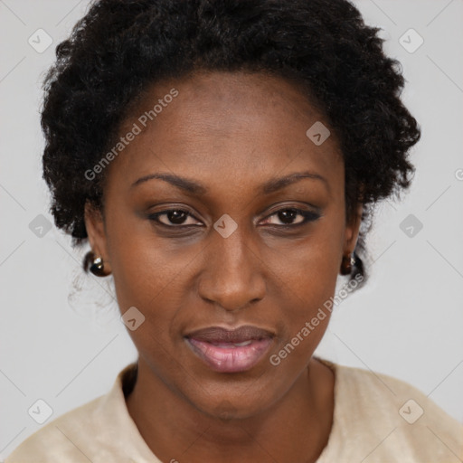 Joyful black adult female with short  brown hair and brown eyes