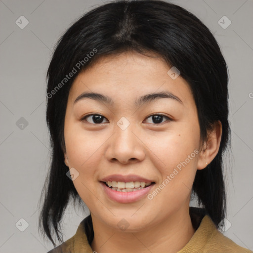 Joyful asian young-adult female with medium  black hair and brown eyes