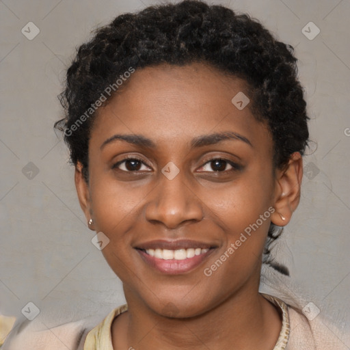 Joyful black young-adult female with short  black hair and brown eyes