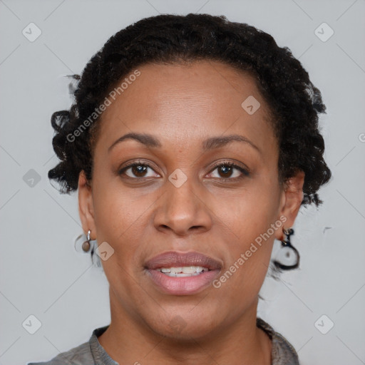 Joyful black adult female with short  brown hair and brown eyes