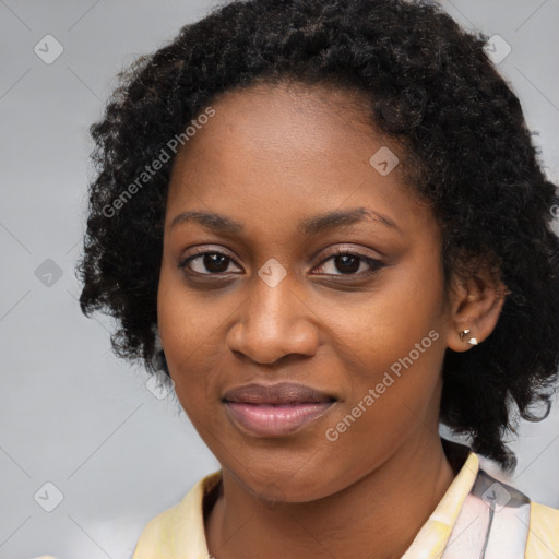 Joyful black young-adult female with long  black hair and brown eyes