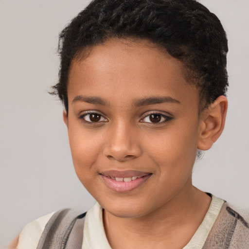 Joyful latino child female with short  brown hair and brown eyes