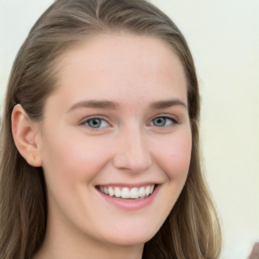 Joyful white young-adult female with long  brown hair and blue eyes