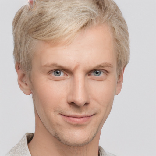 Joyful white adult male with short  brown hair and grey eyes