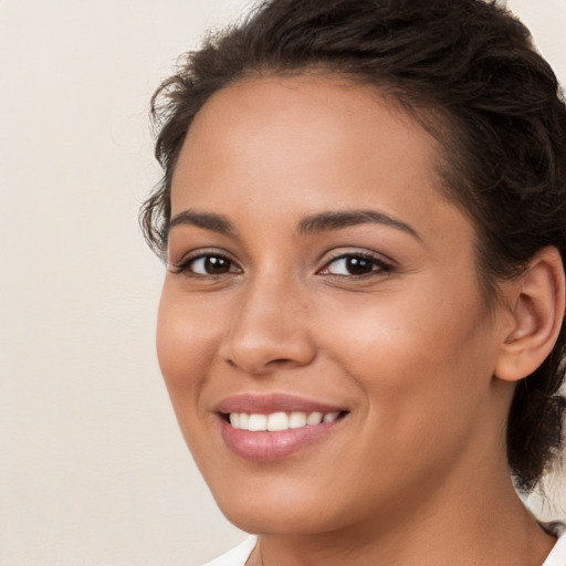 Joyful white young-adult female with medium  brown hair and brown eyes