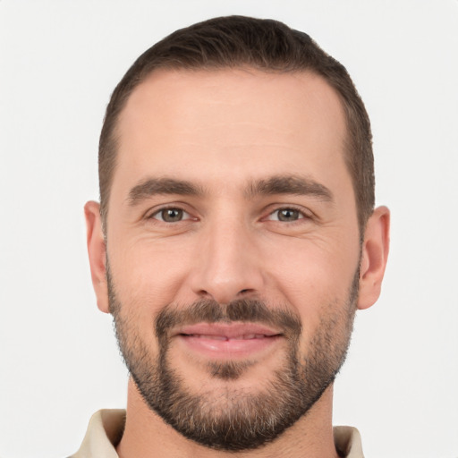 Joyful white young-adult male with short  brown hair and brown eyes