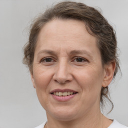 Joyful white adult female with short  brown hair and brown eyes