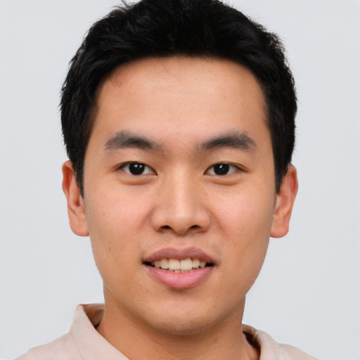 Joyful asian young-adult male with short  black hair and brown eyes