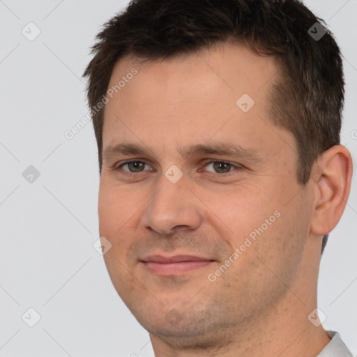 Joyful white young-adult male with short  brown hair and brown eyes