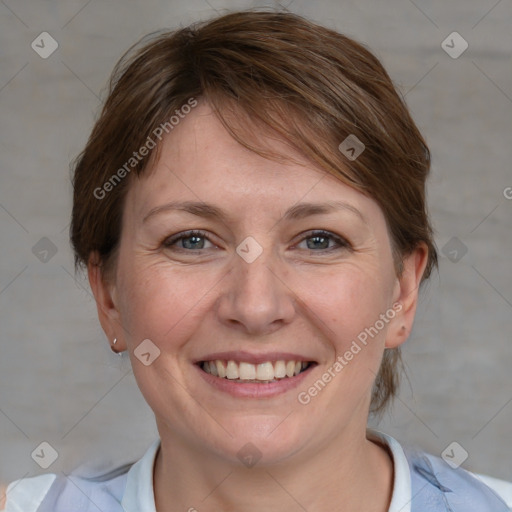 Joyful white adult female with medium  brown hair and blue eyes