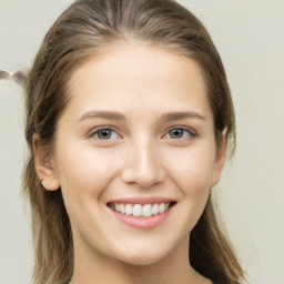 Joyful white young-adult female with long  brown hair and grey eyes