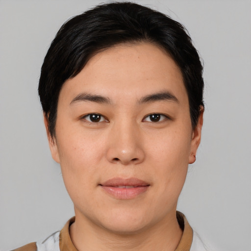 Joyful asian young-adult female with short  black hair and brown eyes