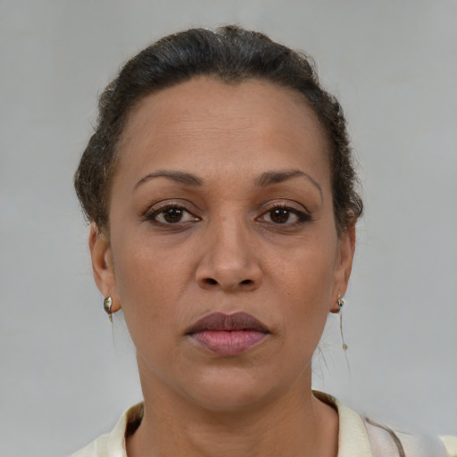 Neutral latino adult female with short  brown hair and brown eyes