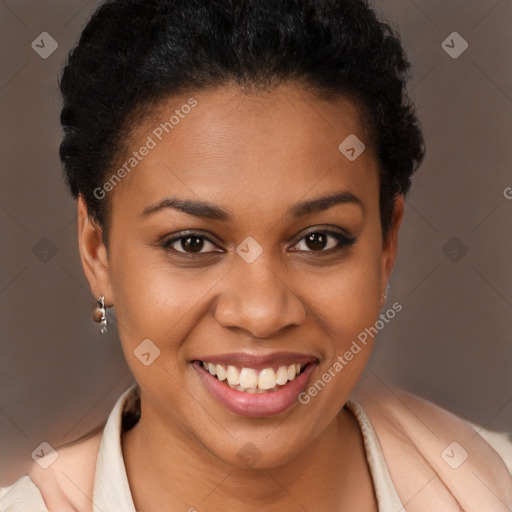 Joyful black young-adult female with short  brown hair and brown eyes