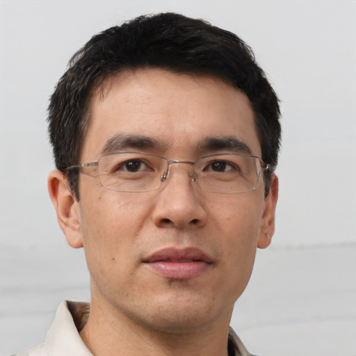 Neutral asian adult male with short  brown hair and brown eyes