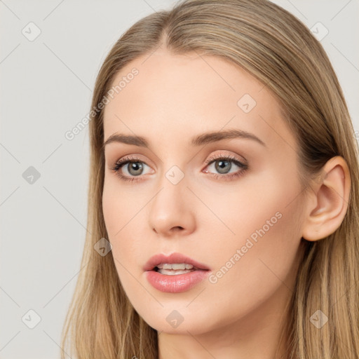 Neutral white young-adult female with long  brown hair and brown eyes