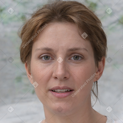 Joyful white adult female with short  brown hair and grey eyes