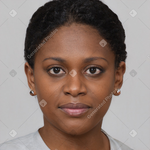 Joyful black young-adult female with short  brown hair and brown eyes