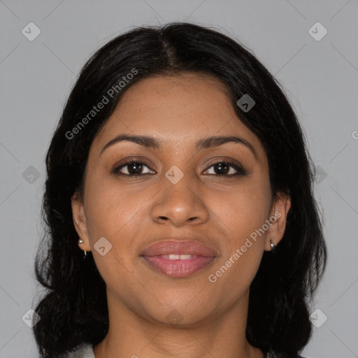 Joyful black young-adult female with long  brown hair and brown eyes