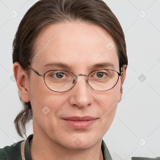 Joyful white adult female with medium  brown hair and grey eyes