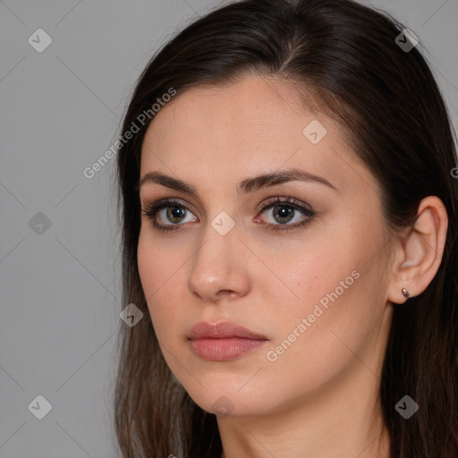 Neutral white young-adult female with long  brown hair and brown eyes