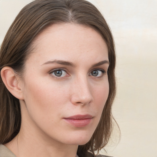 Neutral white young-adult female with long  brown hair and grey eyes