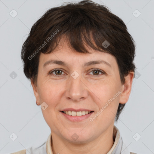 Joyful white adult female with short  brown hair and brown eyes