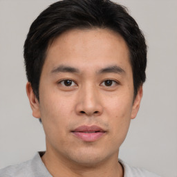 Neutral asian young-adult male with short  brown hair and brown eyes