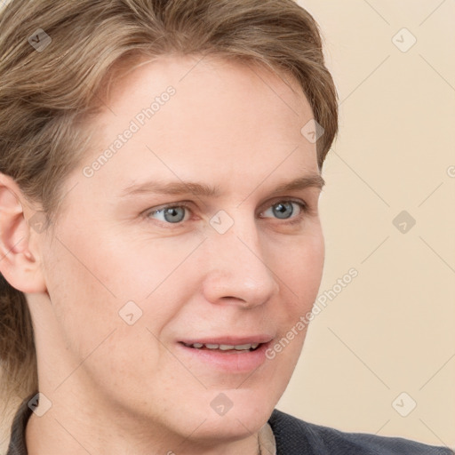 Joyful white young-adult male with short  brown hair and blue eyes