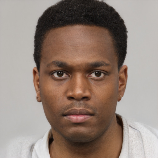 Neutral black young-adult male with short  brown hair and brown eyes