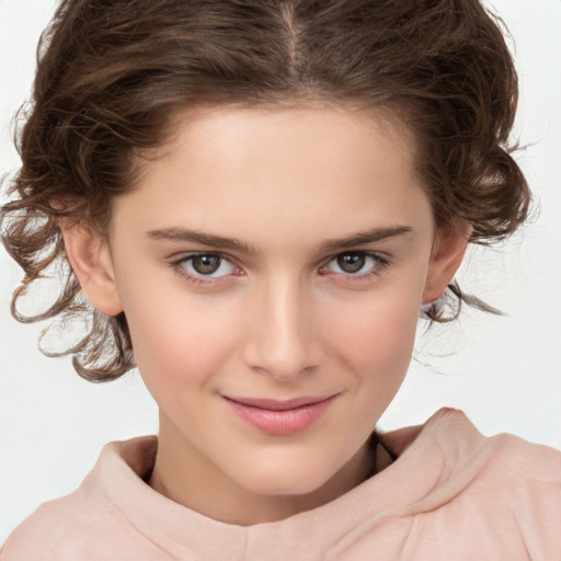 Joyful white child female with medium  brown hair and brown eyes