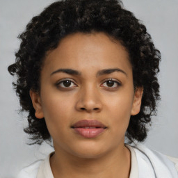 Neutral black young-adult female with medium  black hair and brown eyes