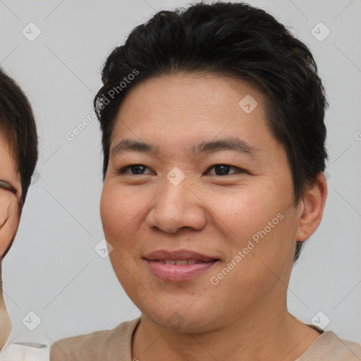 Joyful asian young-adult female with short  brown hair and brown eyes