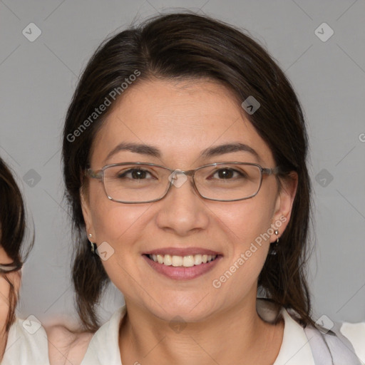 Joyful white adult female with medium  brown hair and brown eyes