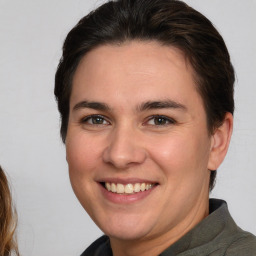 Joyful white young-adult female with medium  brown hair and brown eyes