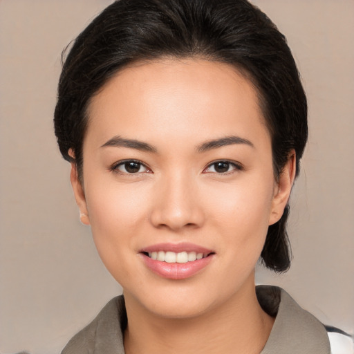 Joyful white young-adult female with medium  black hair and brown eyes