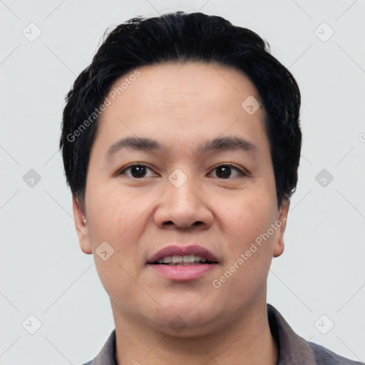 Joyful white young-adult male with short  black hair and brown eyes