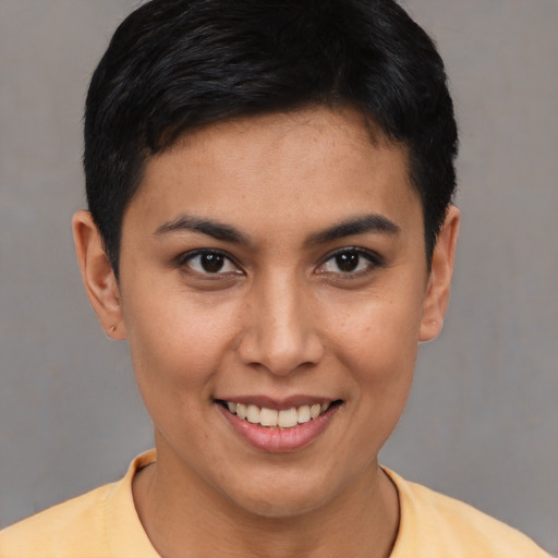 Joyful asian young-adult female with short  brown hair and brown eyes