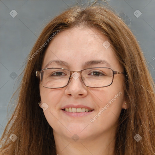 Joyful white adult female with long  brown hair and brown eyes