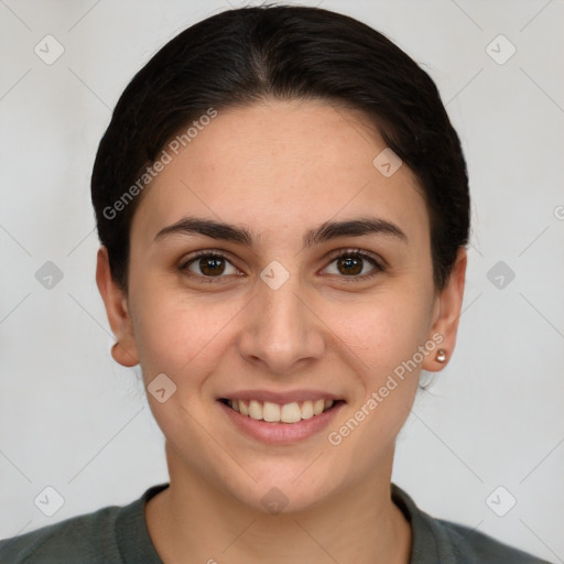 Joyful white young-adult female with short  brown hair and brown eyes