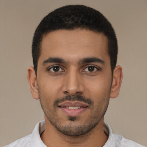 Neutral latino young-adult male with short  black hair and brown eyes